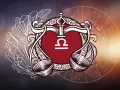 Symbol wagi znak zodiaku w ozdobnej ramie, otoczony kryształami i kołem zodiaku.