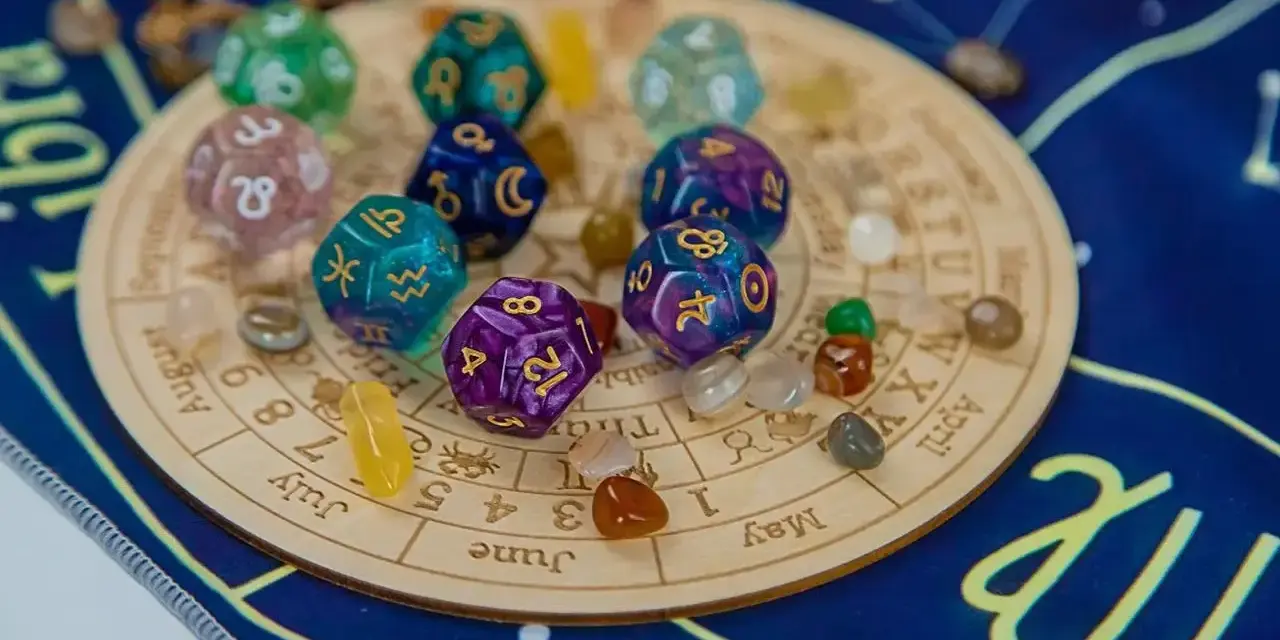 Karty numerologiczne 4 i 11, kości z symbolami zodiaku i kamienie na tle zodiakalnym.