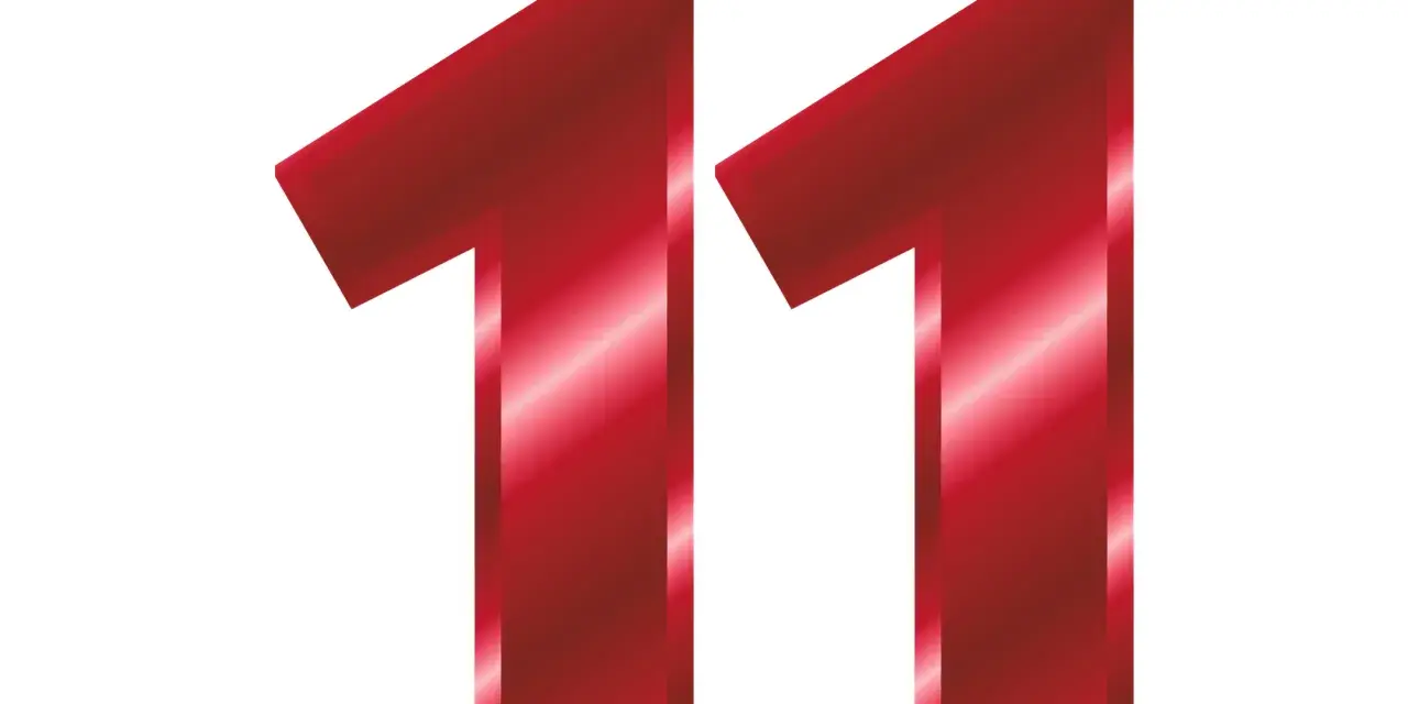 Czerwone, błyszczące cyfry 1 i 1 tworzą liczbę 11. W numerologii 11 jest liczbą mistrzowską, ale redukuje się do 2 (1+1). Może też symbolizować połączenie energii numerologicznej 3 i 11.