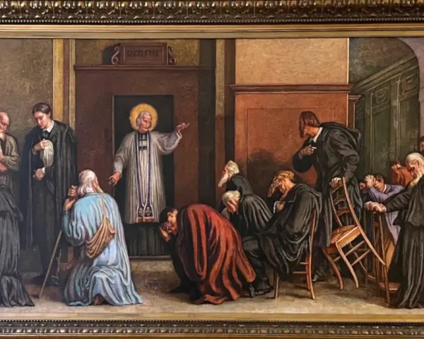 Obraz przedstawia św. Jana Marię Vianneya w otoczeniu wiernych. Ciekawe są jego gesty i skupienie ludzi.
