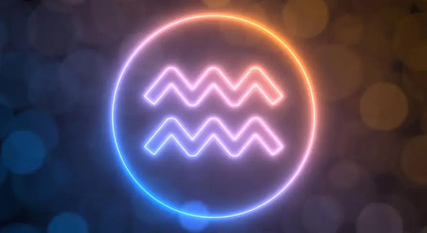 Neonowy symbol Wodnika, od kiedy do kiedy trwa ten znak zodiaku, otoczony poświatą.
