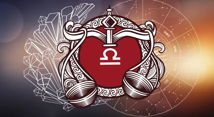 Symbol wagi znak zodiaku w ozdobnej ramie, otoczony kryształami i kołem zodiaku.