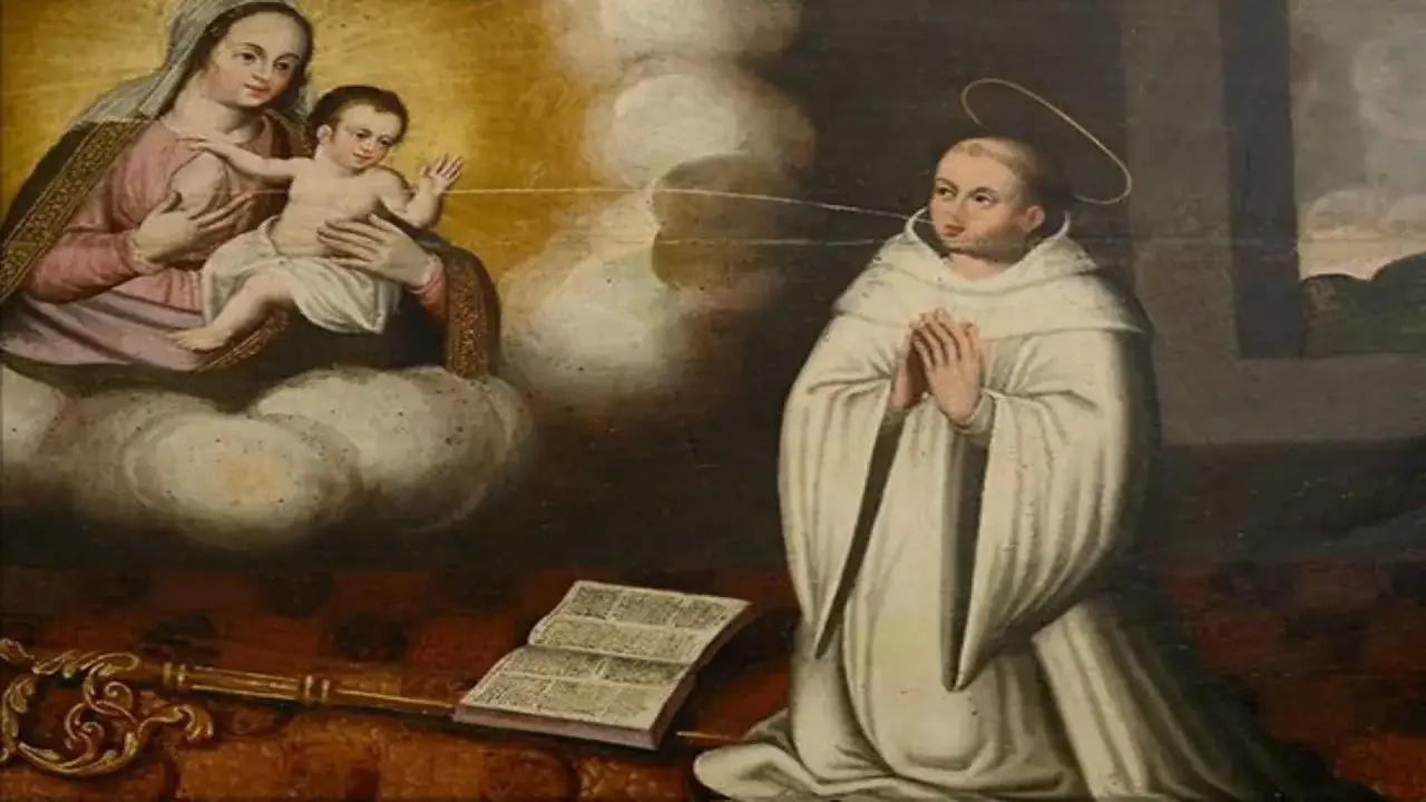Św. Bernard z Clairvaux klęczy przed Matką Boską z Dzieciątkiem. Obok otwarta księga i klucz, symbolizujące jego nauki.